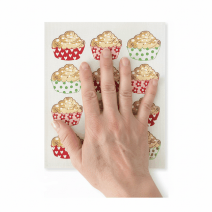 paño sueco y sobre el paño una mano